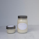 Large and small candles on a light background