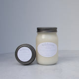 Large and small candles on a light background